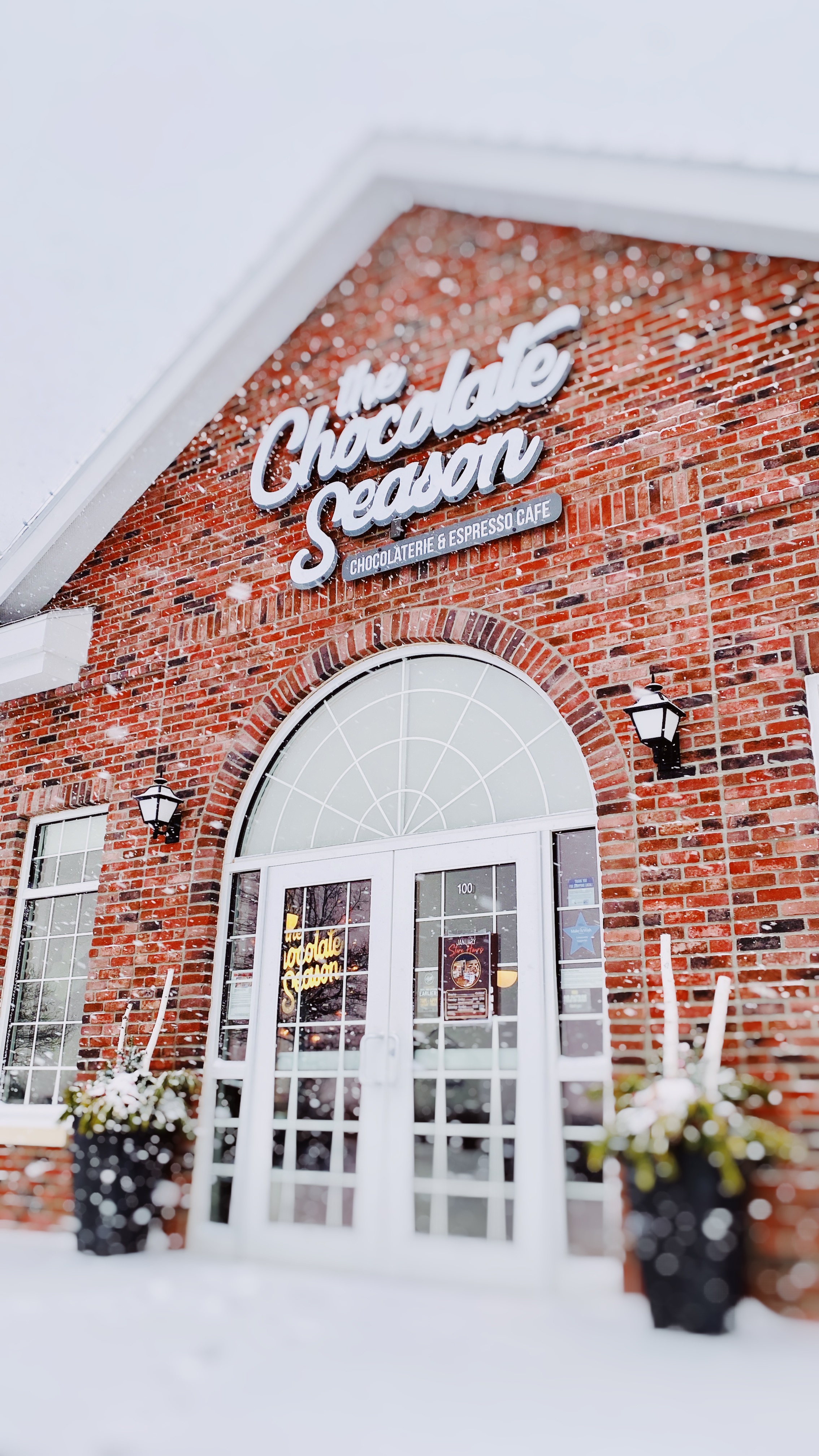 The outside of The Chocolate Season on a snowy afternoon.