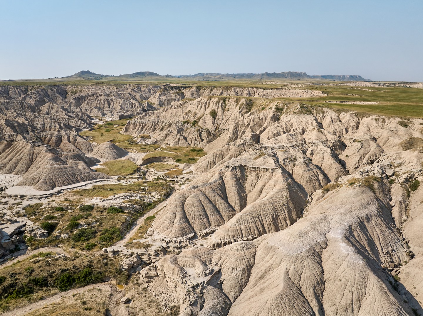 A shot of the rugged landscape of Toadstool Geologic Park | Clay Cook
