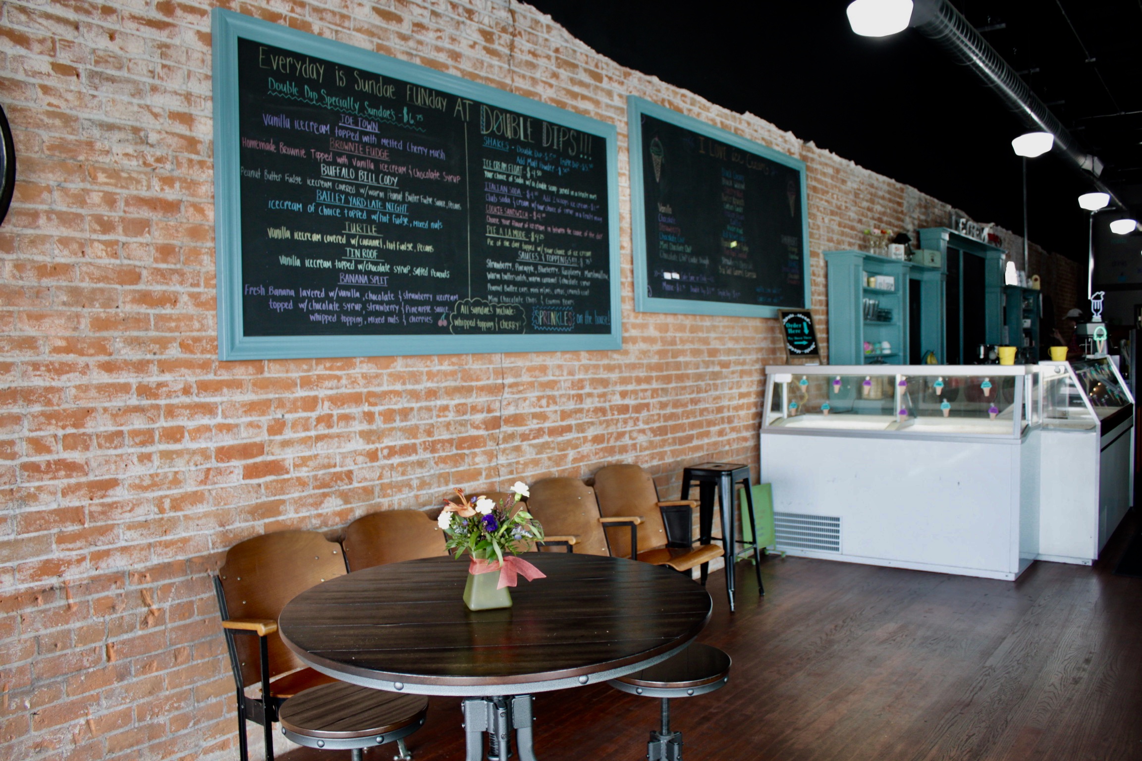 The menu and ice cream counter inside Double Dips Ice Creamery.