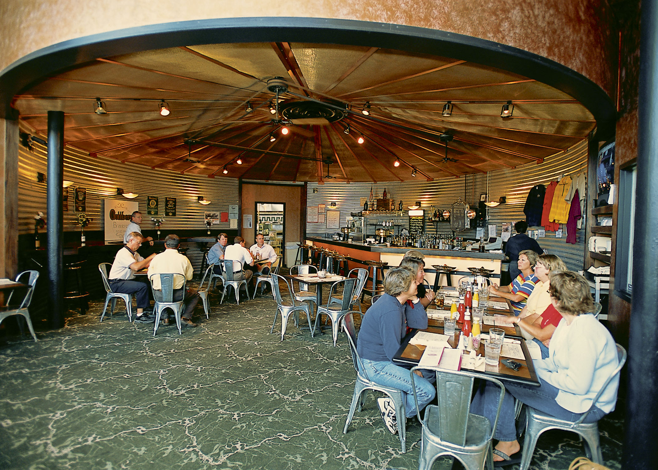 Folks eating at tables around Gottberg's Brewpub inside Duster's.