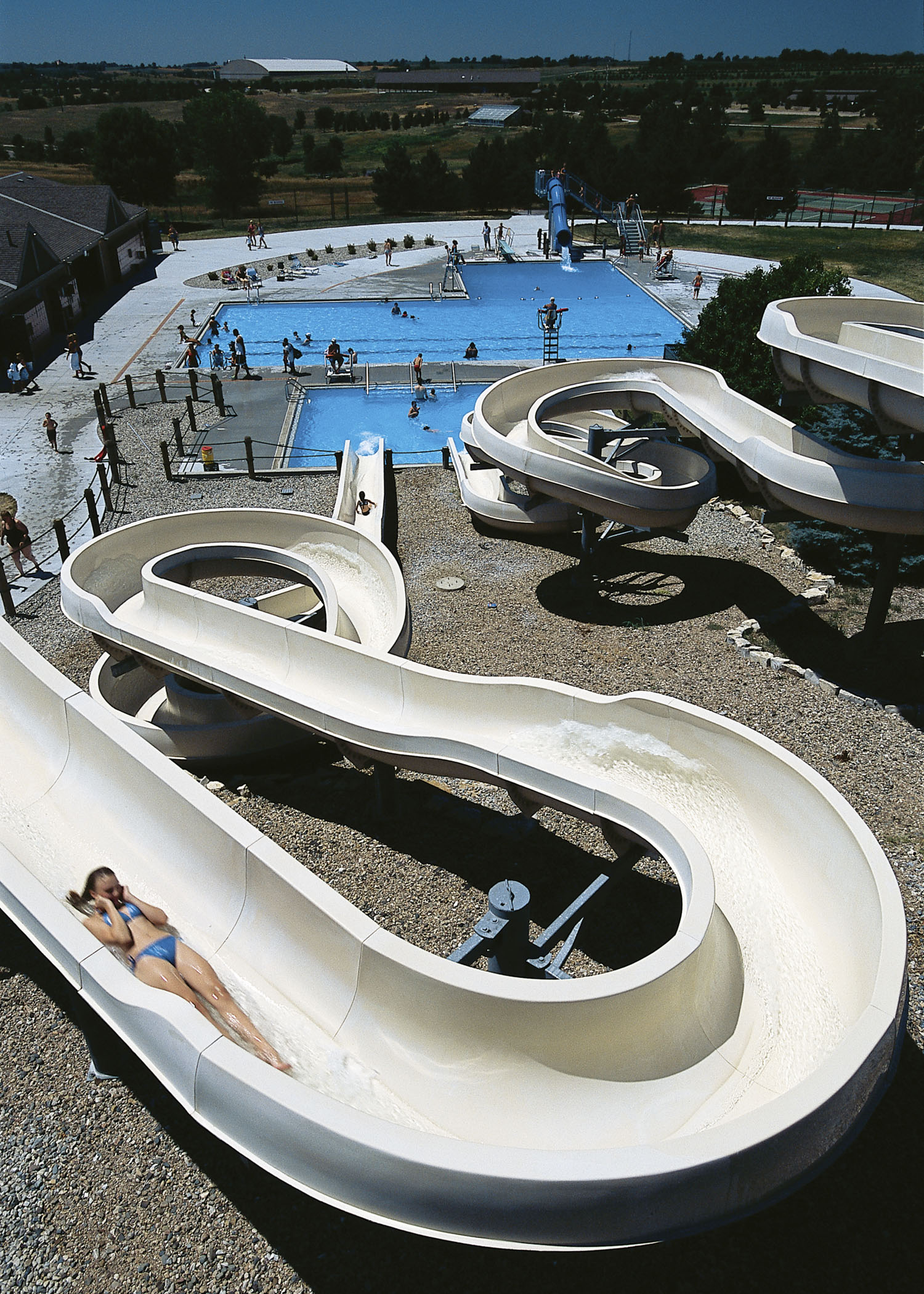 Adults and kids swim and whoosh down twisting waterslides at Eugene T. Mahoney State Park Aquatic Center near Ashland, NE.