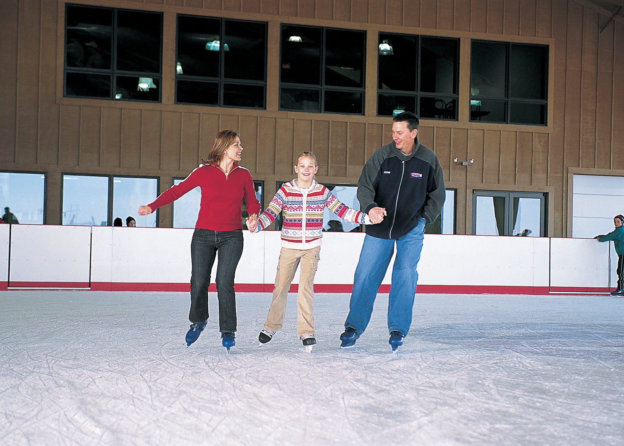 A family ice skating at Mahoney State Park in Ashland.