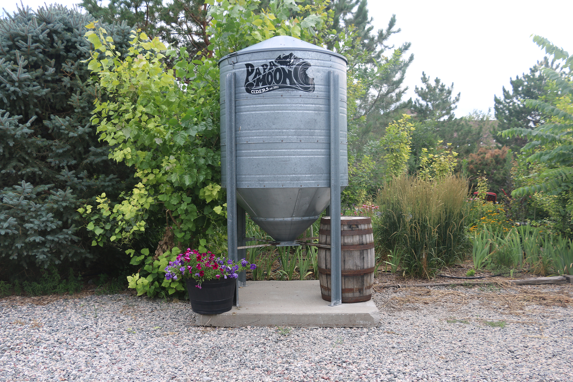 A metal tank with the Papa Moon logo on it at Papa Moon Vineyard & Winery