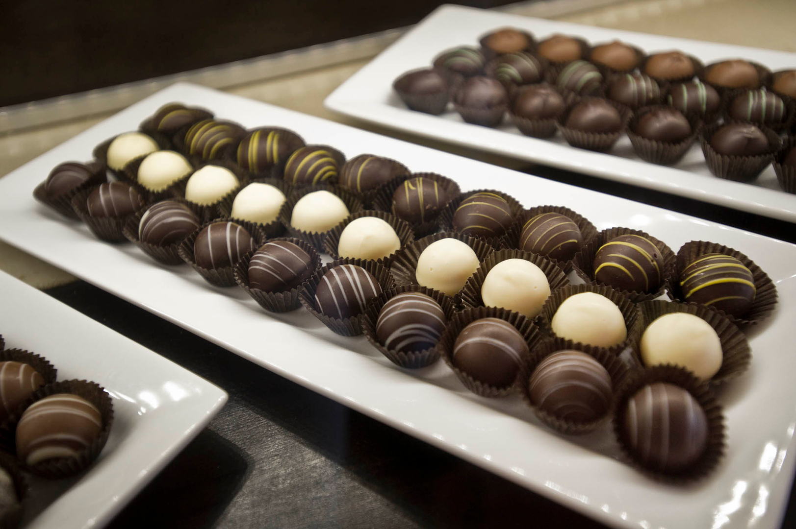 Plates of chocolate truffles from The Chocolate Bar.