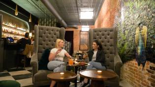 two women sitting in henry j's