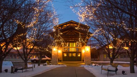 Lied Lodge exterior decoreated with holiday lights.